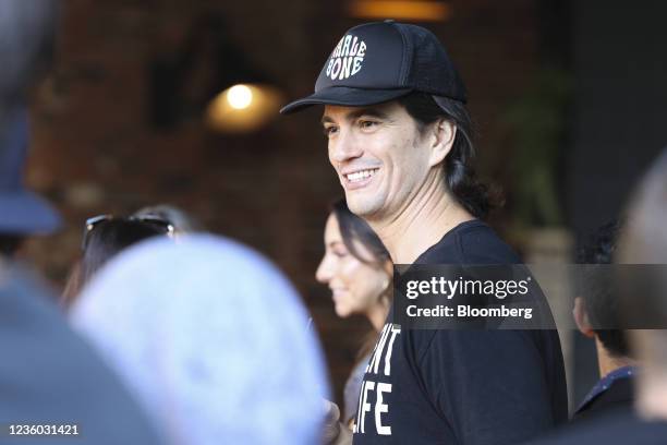 Adam Neumann, co-founder of WeWork, center, during an event on the sidelines of the company's trading debut in New York, U.S., on Thursday, Oct. 21,...