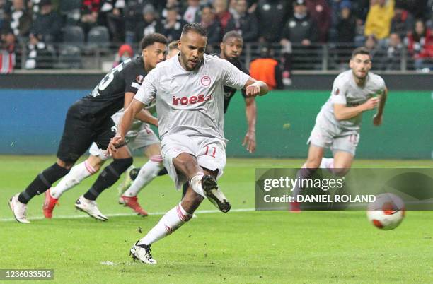 Olympiakos' Moroccan forward Youssef El-Arabi scores the 1-1 from the penatly spot during the UEFA Europa League group D football match between...