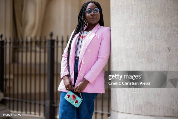 Lois Opoku is seen wearing pink blazer Zara, white tshirt Wangler, Levis denim jeans, sunglasses Fendi, mini bag Fendi on May 30, 2020 in Berlin,...