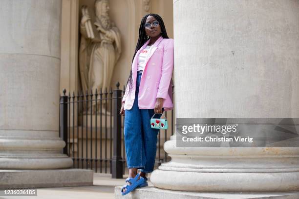 Lois Opoku is seen wearing pink blazer Zara, white tshirt Wangler, Levis denim jeans, sunglasses Fendi, blue Chanel sandals, mini bag Fendi on May...