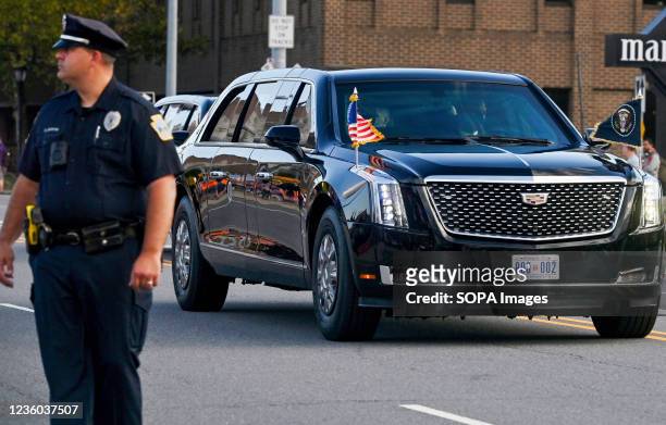 City police officer is seen guarding the street as President Joe Biden's motorcade passes through. President Joe Biden visited Scranton's Steamtown...