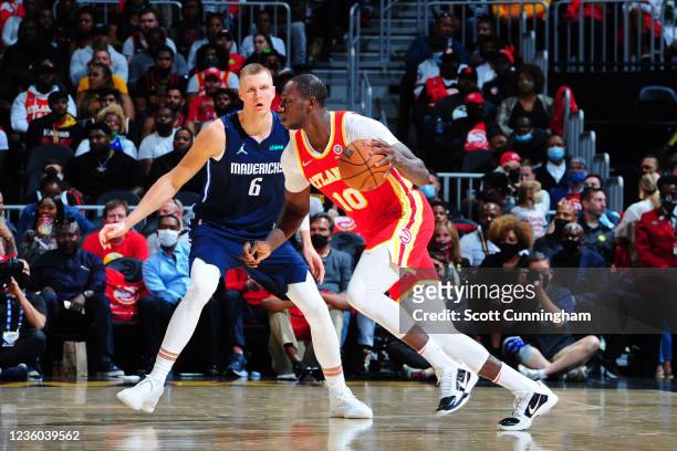 Gorgui Dieng of the Atlanta Hawks drives to the basket against the Dallas Mavericks on October 21, 2021 at State Farm Arena in Atlanta, Georgia. NOTE...