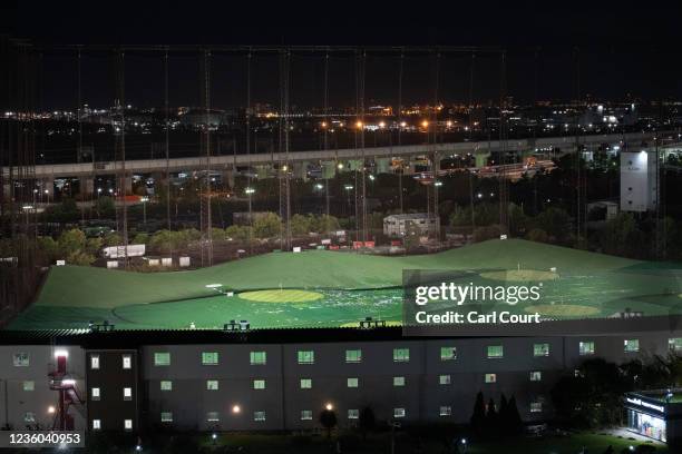 Golf driving range is lit up as golfers practice their swing at night, on October 20, 2021 in Tokyo, Japan. Once a status symbol and a place to do...