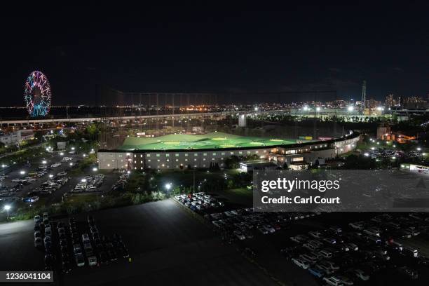 Golf driving range is lit up as golfers practice their swing at night, on October 20, 2021 in Tokyo, Japan. Once a status symbol and a place to do...