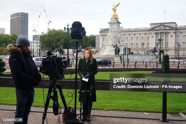 News crew works outside Buckingham Palace in central London after Queen Elizabeth II returned to Windsor Castle on Thursday after spending a night in...