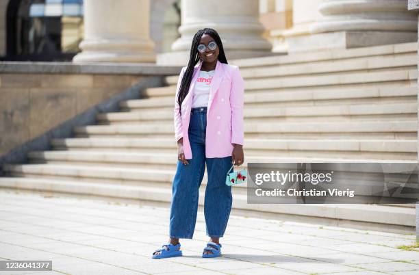 Lois Opoku is seen wearing pink blazer Zara, white tshirt Wangler, Levis denim jeans, sunglasses Fendi, blue Chanel sandals, mini bag Fendi on May...