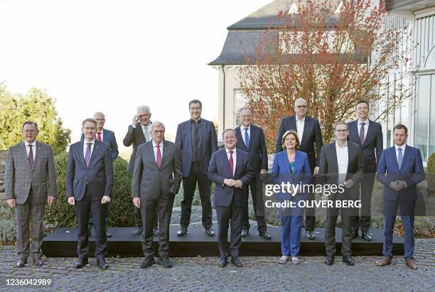 Photo taken on October 22, 2021 shows the state premiers of Germanys 16 federal states posing for a group photo as they meet for a conference in...
