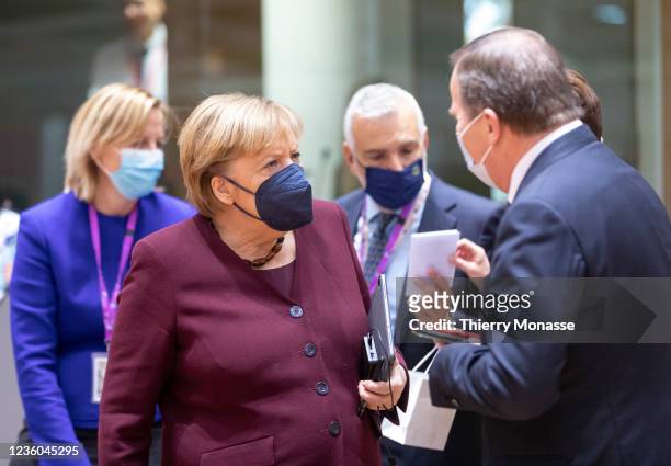German Chancellor Angela Merkel talks with the Swedish Prime Minister Kjell Stefan Lofven prior the start of an EU Summit in the Europa building, the...