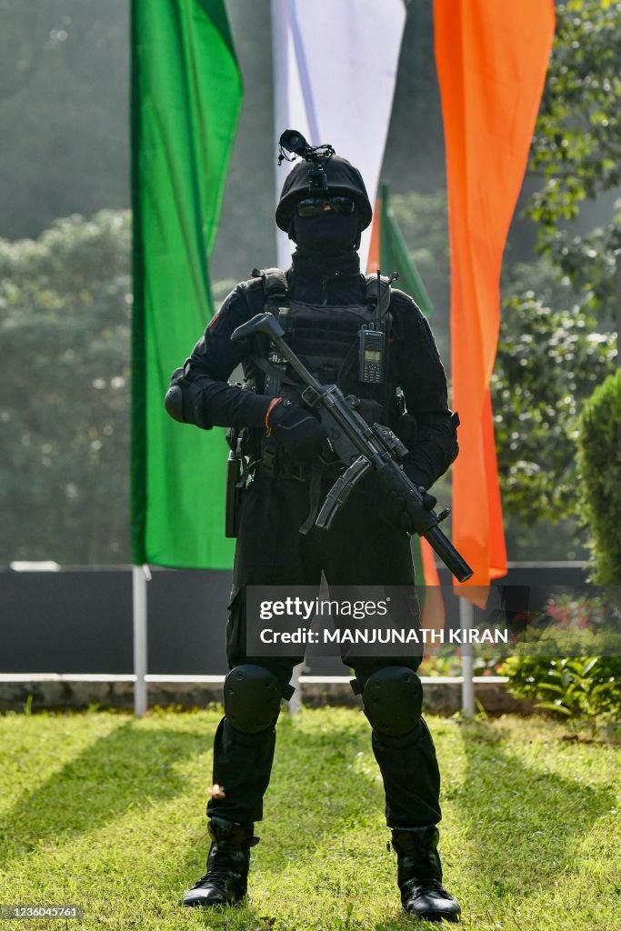 A National Security Guard Commando Stands Guard During Sudarshan a-national-security-guard-commando-stands-guard-during-sudarshan
