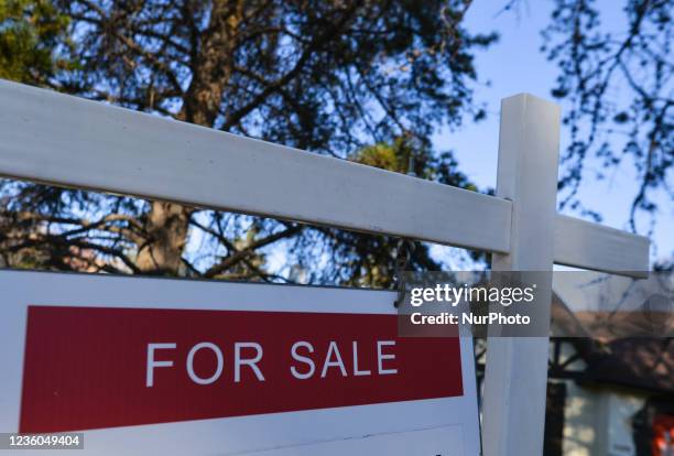 Sign FIR SALE seen outside a house in Edmonton. On Sunday, 21 August 2021, in Edmonton, Alberta, Canada.