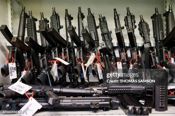 This photograph taken on October 22, 2021 shows guns at a cinema armory in La Courneuve, near Paris. - They learned with horror the fatal shooting of...