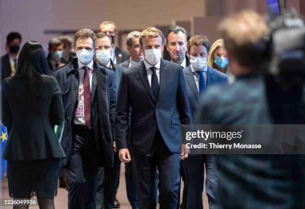 French President Emmanuel Macron walks away at the end of the second day of an EU Summit in the Justus Lipsius building, the EU Council headquarter...