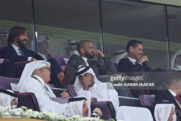 Italian coach and World Cup winner Andrea Pirlo, Brazilian footballer Dani Alves and former Spanish international footballer Fernando Hierro watch...