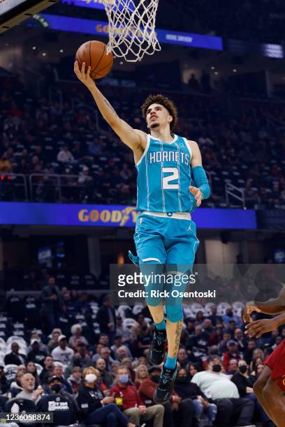 LaMelo Ball of the Charlotte Hornets shoots in the first half against the Cleveland Cavaliers at Rocket Mortgage Fieldhouse on October 22, 2021 in...