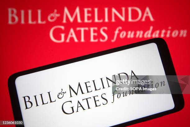 In this photo illustration a Bill & Melinda Gates Foundation logo of an US private foundation founded by Bill Gates and Melinda French Gates is seen...