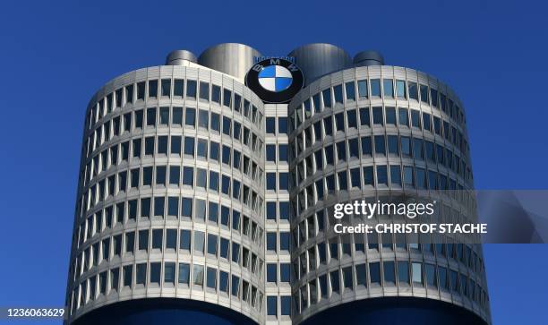 The logo of Germany's carmaker BMW is seen at the headquarters building in Munich, southern Germany, on October 22, 2021.