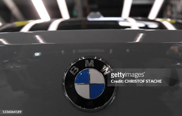 The logo of German carmaker BMW can be seen on a car at an assembly line in the main company of Germany's carmaker BMW in Munich, southern Germany,...