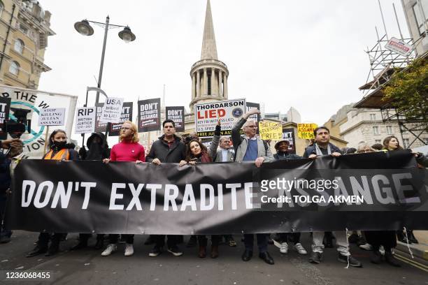 Protesters, including Julian Assange's partner Stella Moris , march behind a banner calling for the release of Wikileaks founder Julian Assange who...