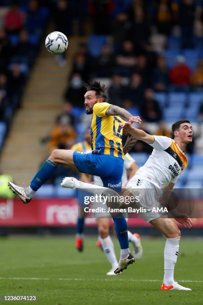 Ryan Bowman of Shrewsbury Town and Lloyd Jones of Cambridge United during the Sky Bet League One match between Shrewsbury Town and Cambridge United...