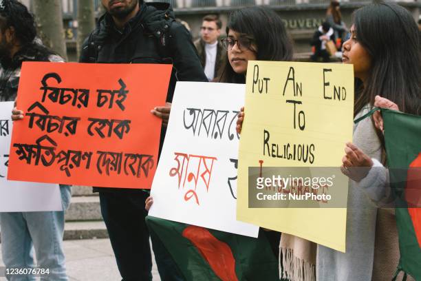People take part in protest in front of Dom Cathedral in Cologne, Germany on Oct 23 against violence attack against Hindus in Bangladesch during...