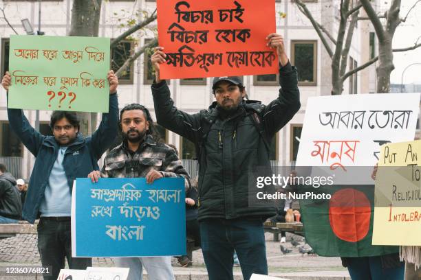 People take part in protest in front of Dom Cathedral in Cologne, Germany on Oct 23 against violence attack against Hindus in Bangladesch during...