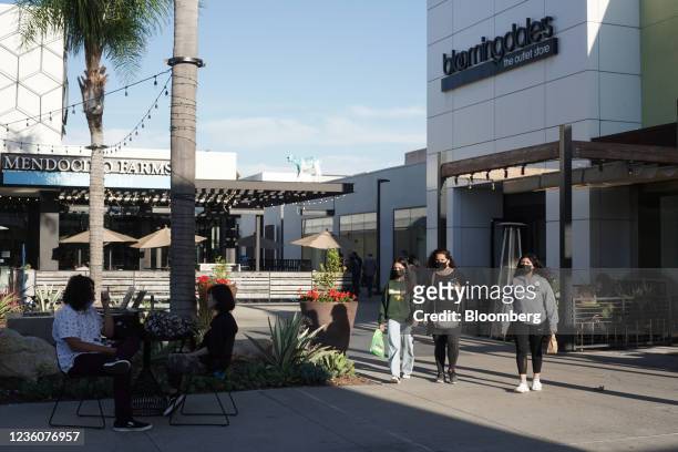 Shoppers outside a Bloomingdale's outlet store at the Westfield Mission Valley shopping mall in San Diego, California, U.S., on Friday, Oct. 22,...