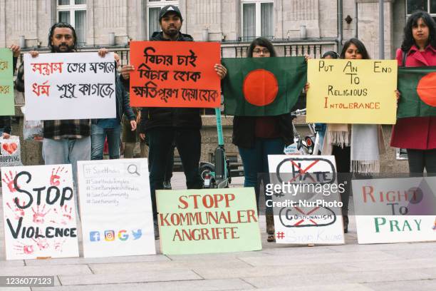 People take part in protest in front of Dom Cathedral in Cologne, Germany on Oct 23 against violence attack against Hindus in Bangladesch during...