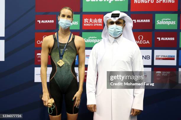 Emma Mckeon of Australia wins the gold medal in the Women's 100m Individual Butterfly during day Three of the FINA Swimming World Cup Doha at Hamad...