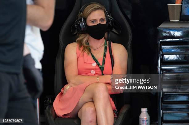 Australian cyclist Tiffany Cromwell, the girfriend of Mercedes' Finnish driver Valtteri Bottas, sits in the garage during the third practice session...