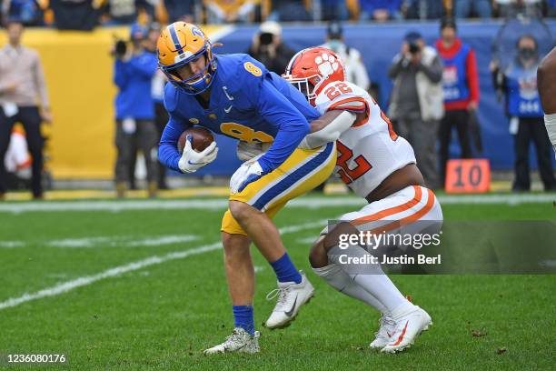 Kenny Pickett of the Pittsburgh Panthers is wrapped up for a tackle by Trenton Simpson of the Clemson Tigers in the first quarter during the game at...