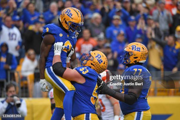 Jordan Addison of the Pittsburgh Panthers celebrates with Jake Kradel after a 23 yard touchdown reception in the second quarter during the game...