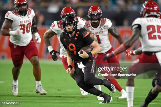 Miami quarterback Tyler Van Dyke carries the ball in the first quarter as the University of Miami Hurricanes faced the North Carolina State...