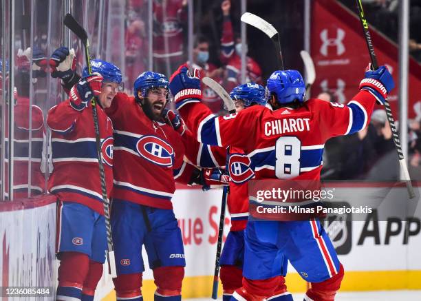 Mathieu Perreault of the Montreal Canadiens celebrates his third goal of the game with teammates Tyler Toffoli, Cole Caufield and Ben Chiarot during...