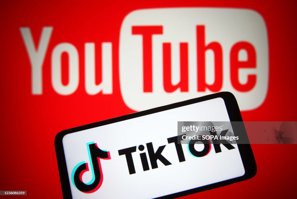 In this photo illustration a TikTok logo is seen on a...