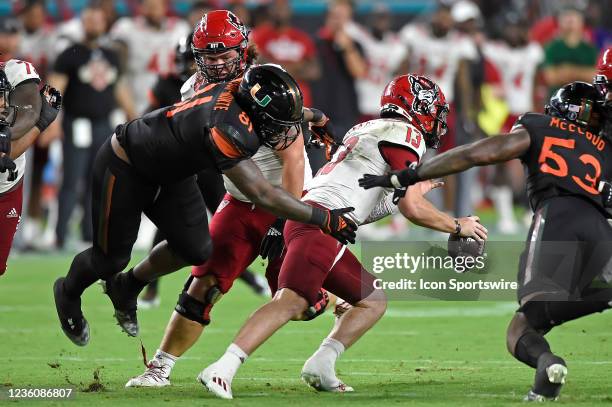 Miami defensive lineman Jared Harrison-Hunte pressures NC State quarterback Devin Leary in the fourth quarter as the University of Miami Hurricanes...