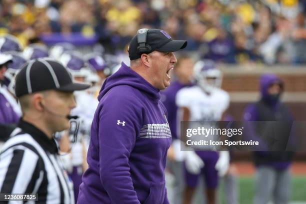 Northwestern Wildcats head coach Pat Fitzgerald shouts instructions to his players on the field during a B1G 10 conference football game between the...