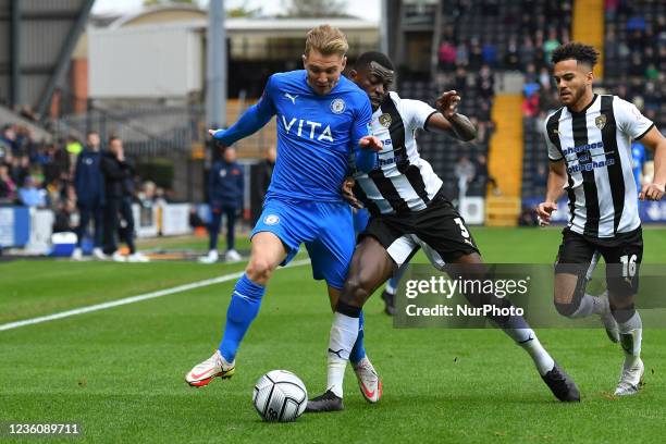Joel Taylor of Notts County battles with Ben Whitfield of Stockport County during the Vanarama National League match between Notts County and...
