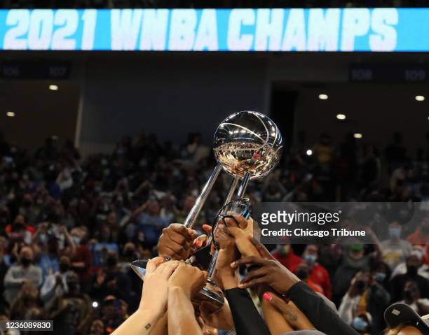 Chicago Sky players hold celebrate after winning the WNBA championship on Oct. 17 at Wintrust Arena in Chicago.