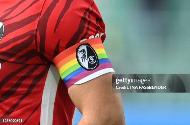 Freiburg's German defender Christian Guenter wears a captains armband with a rainbow, which is a symbol of lesbian and gay acceptance and lifestyle,...