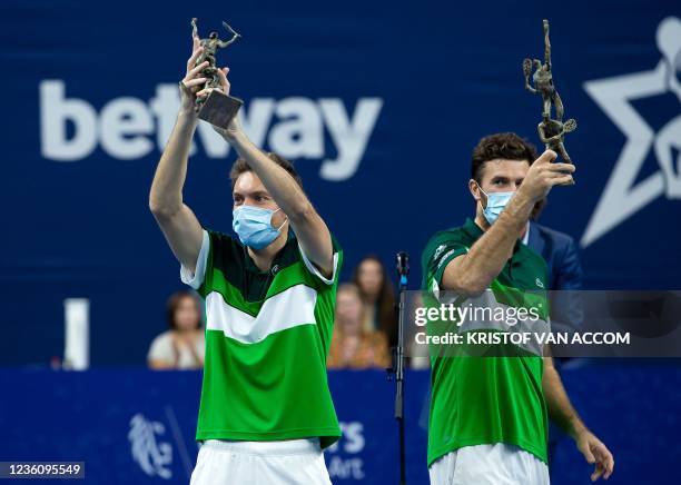 France's Nicolas Mahut and France's Fabrice Martin celebrate after they won their double men's game against Dutch pair Wesley Koolhof - Jean-Julien...