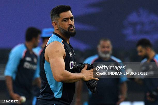 India's team mentor Mahendra Singh Dhoni attends a warm up session before the start of the ICC mens Twenty20 World Cup cricket match between India...