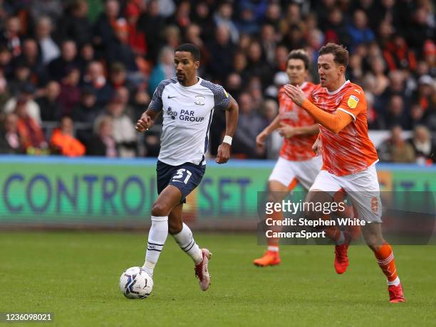Preston North End's Scott Sinclair outpaces Blackpool's Ryan Wintle during the Sky Bet Championship match between Blackpool and Preston North End at...