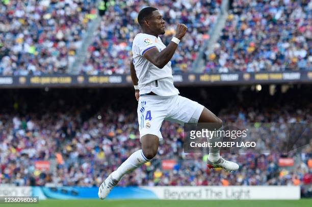 Real Madrid's Austrian defender David Alaba celebrates scoring the opening goal during the Spanish League football match between FC Barcelona and...