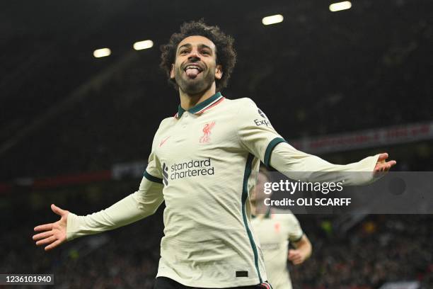 Liverpool's Egyptian midfielder Mohamed Salah celebrates after scoring their fifth goal, his third during the English Premier League football match...