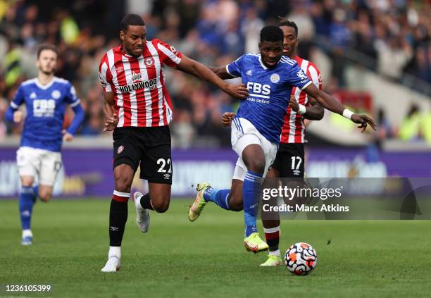 Kelechi Iheanacho of Leicester City in action with Mathias Jorgensen and Ivan Toney of Brentford during the Premier League match between Brentford...