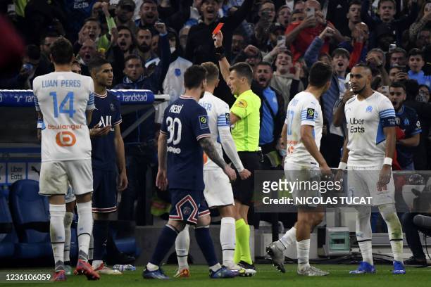 Paris Saint-Germain's Moroccan defender Achraf Hakimi reacts as he receives a red card during the French L1 football match between Olympique...
