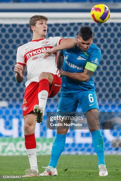 Dejan Lovren of Zenit St. Petersburg and Aleksander Sobolev of Spartak Moscow vie for the ball during the Russian Premier League match between FC...