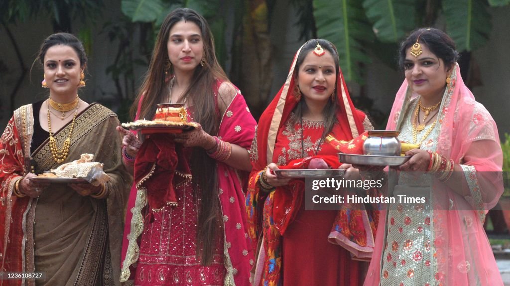 Women perform traditional Pooja on the occasion of Karva Chauth at