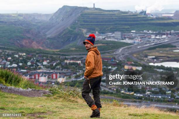 Reindeer herder Tomas Kuhmunen, a member of the indigenous Sami community, is pictured on August 25 on the outskirts of Kiruna, overlooking the iron...