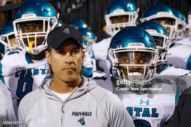 Coastal Carolina Chanticleers head coach Jamey Chadwell stands with his team as they prepare to take the field prior to a college football game...